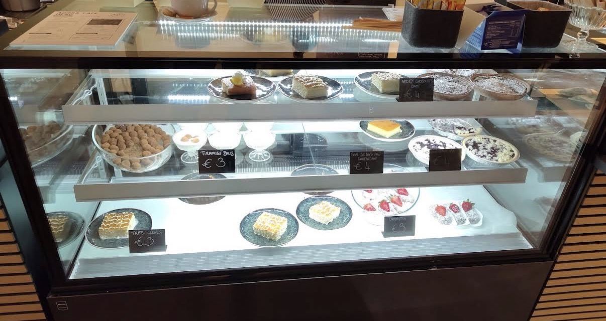 The dessert case — tres leches, cheesecakes, lamingtons